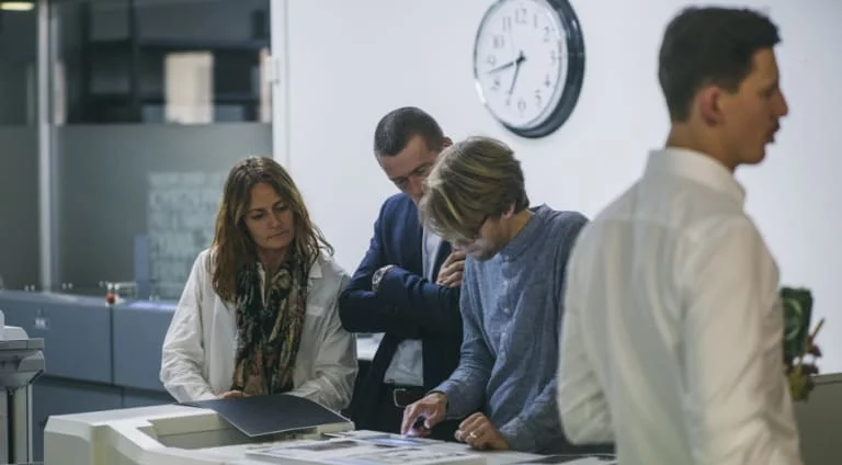 Ink n Art team standing together working.